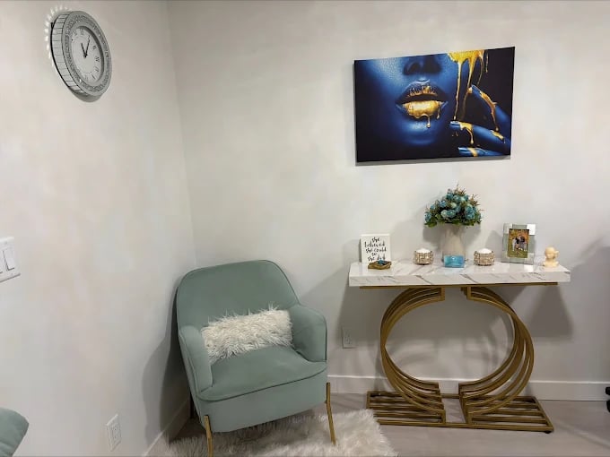 Modern room corner with blue art, mint chair, and decorative console table